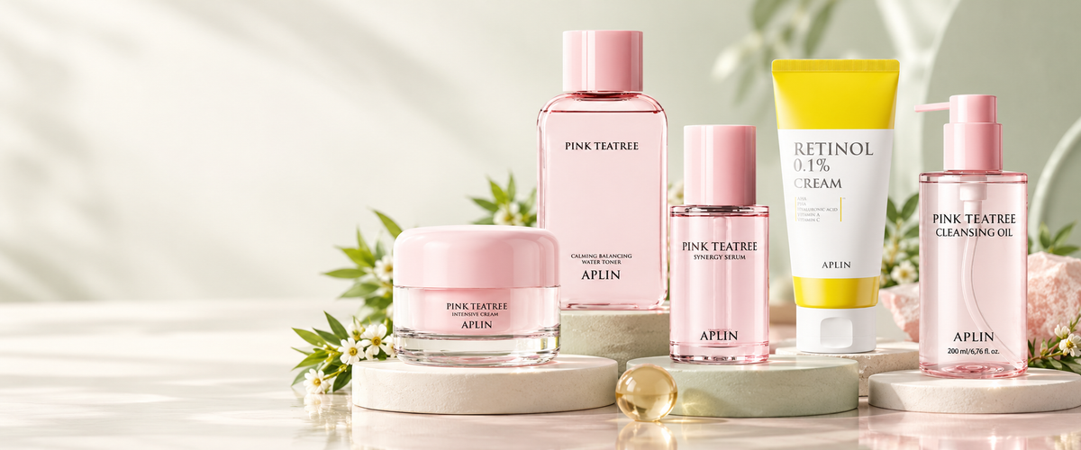 APLIN Pink Tea Tree, Retinol and cleansing products arranged on softly colored studio plinths
